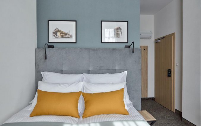 Slaapkamer van hotel 32 Krakow Old Town in Krakau